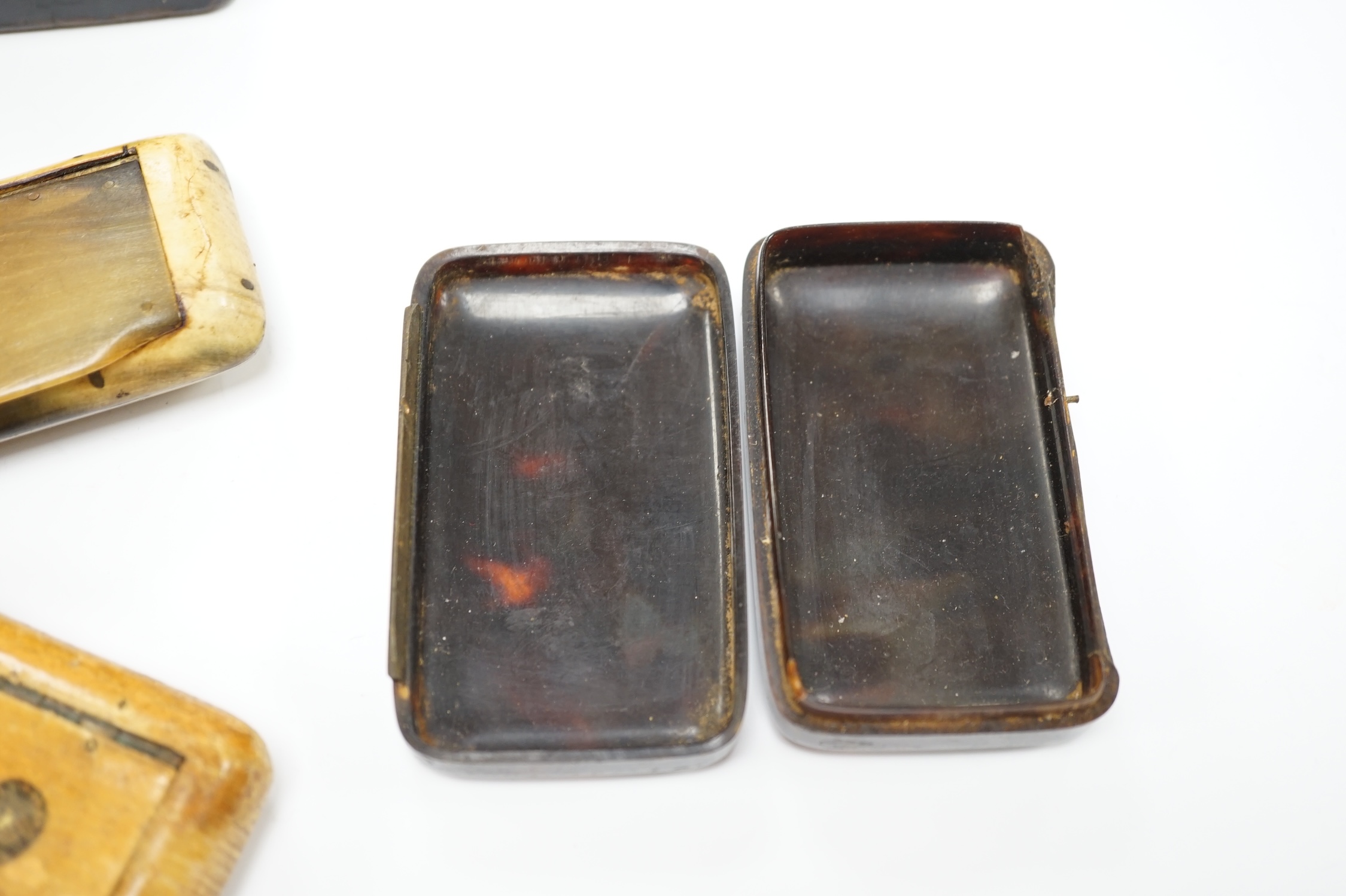Five 19th century snuff boxes including horn and papier-mache examples, largest 7.5cm wide